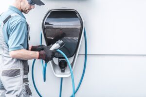 Person using an electric charger for an electric vehicle