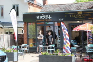 Left to right: Café assistant Rory and Foundation Pathways Cameron standing outside the Kimel Café in Wokingham. 