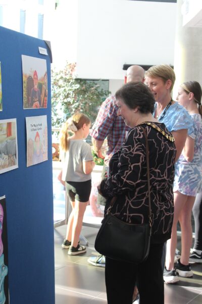 The Worshipful the Mayor of the Borough of Bracknell Forest Councillor Janet Cochrane and Sue Dew-Gosling, Creative Arts Lecturer at Activate Learning look at the art on display. 