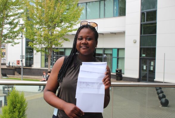 Ngozi Ali, preferred name Rita holding her full time GCSE pathway results at Bracknell and Wokingham College. 
