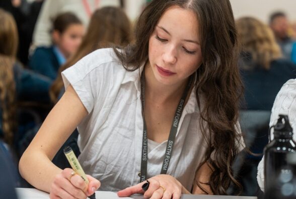A sixth form pupil from Edgbarrow School takes part in a climate change group activity. 