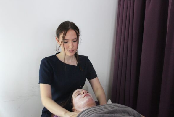 Maddie Sharp, Beauty Therapy Level 3 student gives a shoulder massage to a client as part of a facial treatment. 
