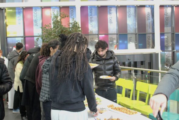 Students and staff helping themselves to the Community Iftar Meal