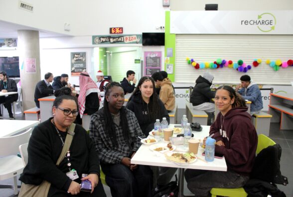 Bina Howard, Curriculum Manager at Activate Learning enjoying the Iftar meal with some of the students in her faculty