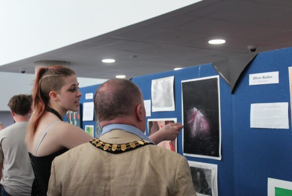 Izzy Marriott, an Art and Design Level 2 Diploma student, talks about her artwork to The Worshipful the Mayor of the Borough of Bracknell Forest Councillor Peter Frewer.