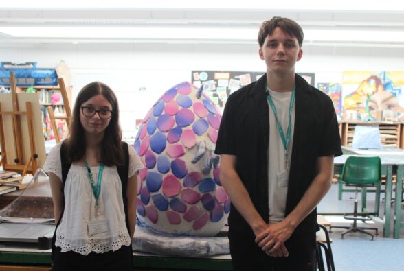 Art and Design Level 3 students Emily and Jay with the egg while it was being created.