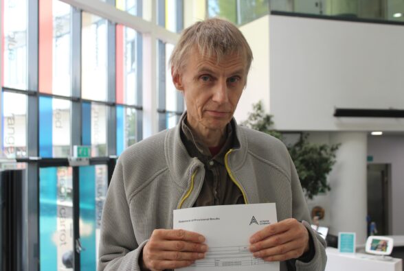 Adult student, Veli Albert Kallio celebrates his GCSE English results