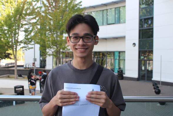 ESOL student, Truong Dinh celebrates his GCSE maths results