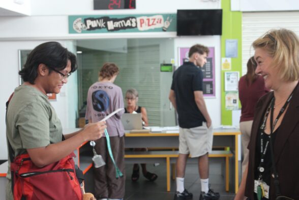 A male student celebrates his results with Lorna Vaughn, Curriculum Manager at Activate Learning