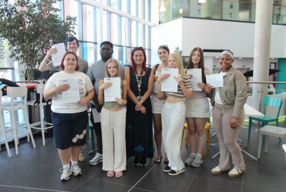 T Level Health students celebrate their success with their teacher, Wendy Williams